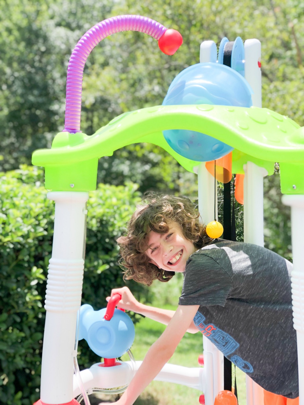 boy playing with the little tykes tumblin tower